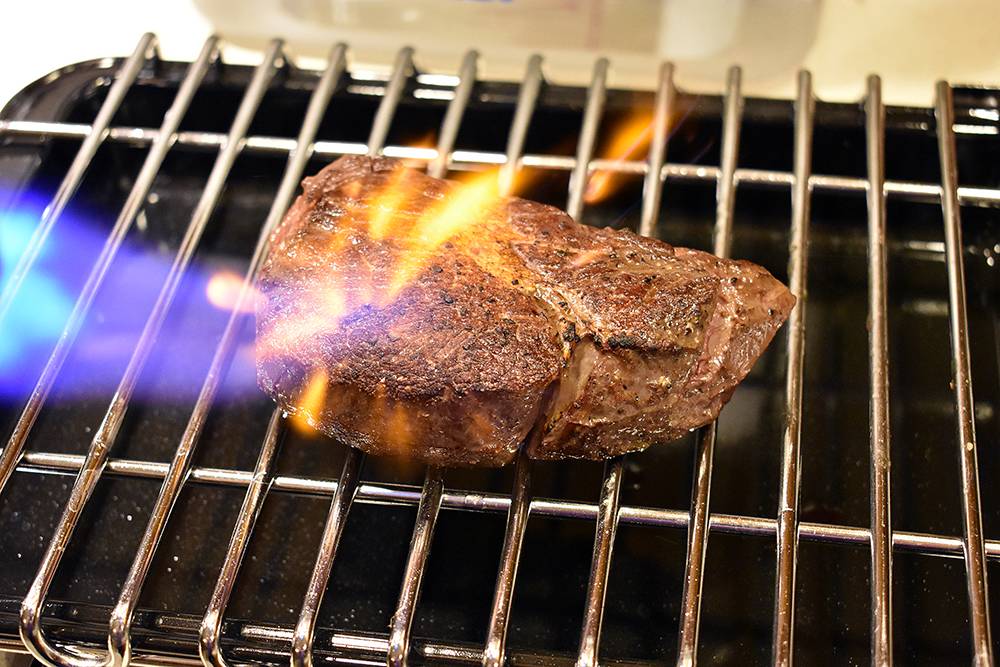 searing steak with torch
